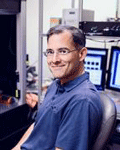 David Schaffer sits at a desk in a lab