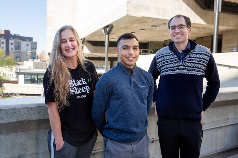 Black Sheep Foods startup team stands on an outdoor terrace. Ismael Montanez, center. (Photo by Brittany Hosea-Small)